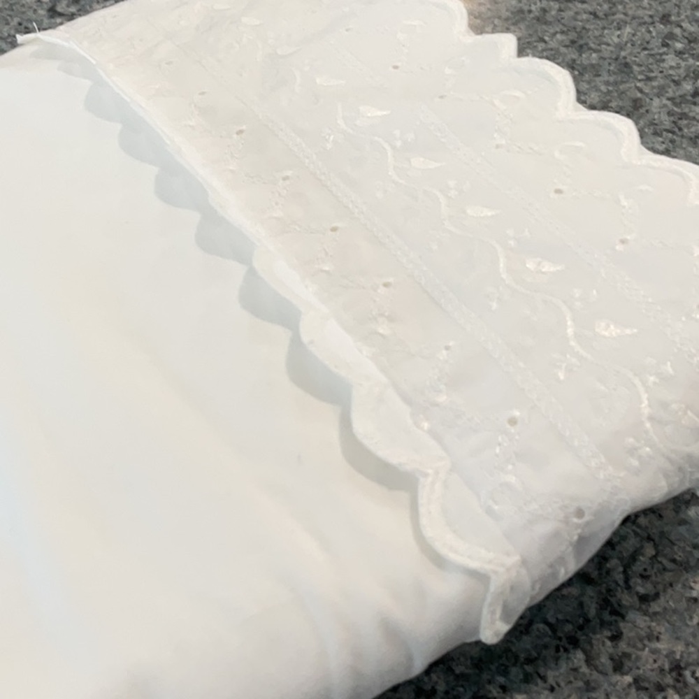 JCPenney top twin sheet. White with eyelet lace.